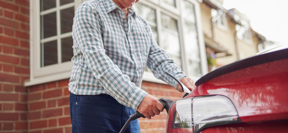 Man charging his EV at home